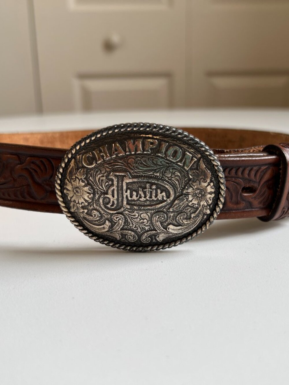 Justin Champion Western belt with silver buckle, great condition.